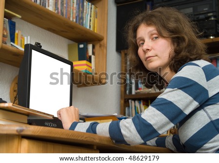 The woman at a computer in the room