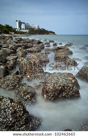 Very slow slow shutter speed for take this photo by use 10stop of ND filter. Stone beach in Pattaya beach, Thailand