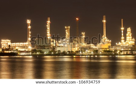 Landscape of river and oil refinery factory between sun rise time in Chao praya river, Bangkok, Thailand.
