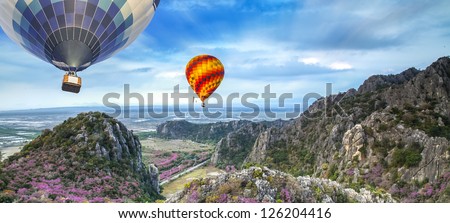 Lanscape of mountain and balloon with sakura flower