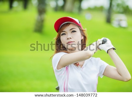 lady playing and golf swing with smile