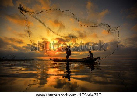 Fisherman Of Bangpra Lake In Action When Fishing, Thailand
