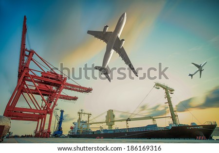 Boat and air plain for in background of Container Cargo freight ship with working crane loading bridge in shipyard at dusk for Logistic Import Export background