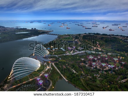 Bird eye of Landscape from bird view of Cargo ships entering one of the busiest ports in the world, over the Garden by the bay in Marina bay sand