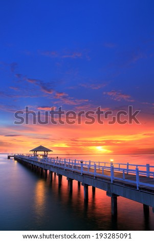 Wooded bridge in the beach island port between sunrise.