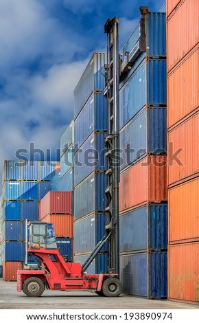 Crane lifter handling container box loading to truck in import export logustic zone