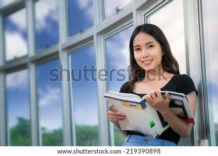 Asia students read a book in Library