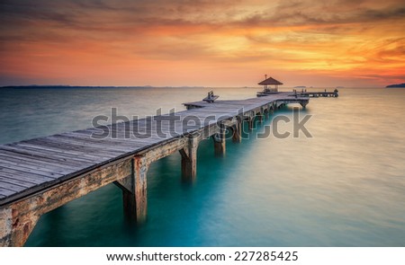 Wood bridge along sunset in island beach