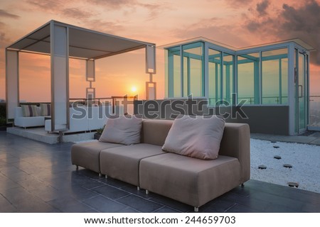 Relax coner on condominium roof top garden with sofa and table