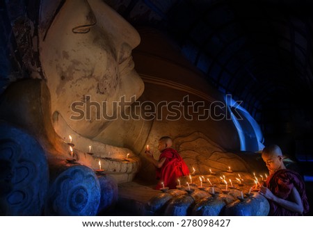 Mini Monk in meditation inside temple in Bagan Mandalay Myanmar
