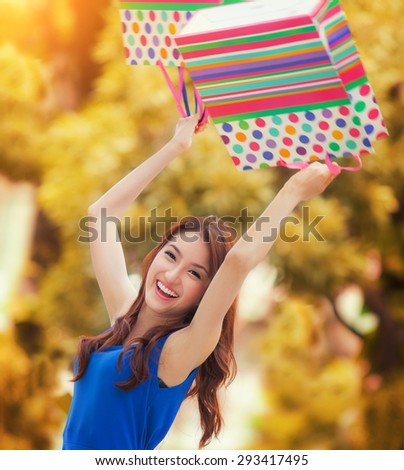 Asian lady enjoy shopping with shopping bag