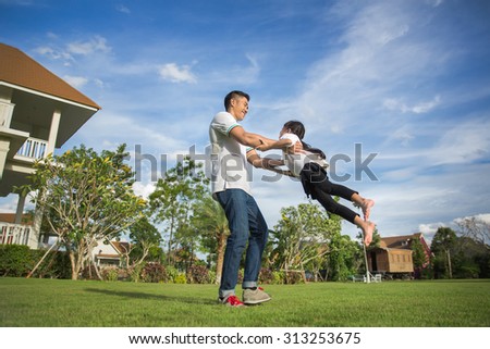 Healthy father and daughter playing together at the Home carefree happy fun smiling lifestyle, family concept
