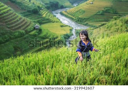 Girl in the terrace rice farm with countryside background