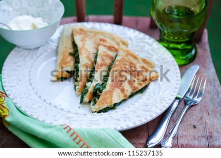 Spinach pastry on wooden surface. Also available in vertical format.