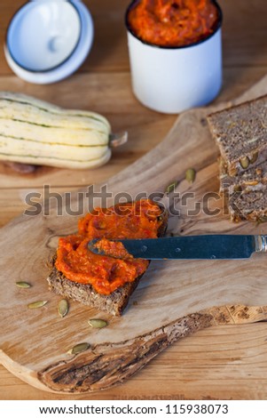 Pumpkin dip with slices of bread. Also available in vertical format.