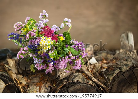 Wild flowers on  a grunge wood backdrop with copy space. Also available in vertical format.