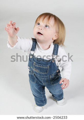Blue Eye Baby Girl Standing And Reaching Up Stock Photo ...
