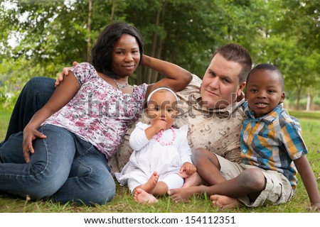 Happy Mixed Family Is Having A Nice Day In The Park