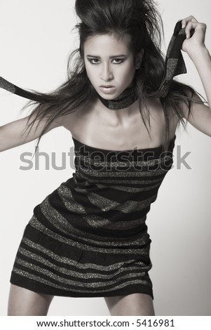 A 15 year old pretty girl in the photo studio on different backgrounds in different styles.