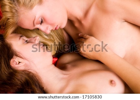 stock photo Two young lesbian girls relaxing in a bed