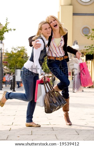 stock-photo-two-young-girls-shopping-in-the-sunny-weather-19539412.jpg