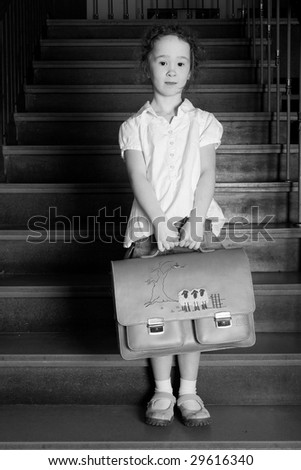 Young girl on school with a old school outfit