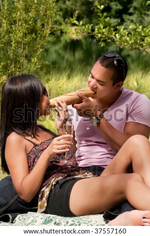 Young happy asian couple enjoying their time outdoors