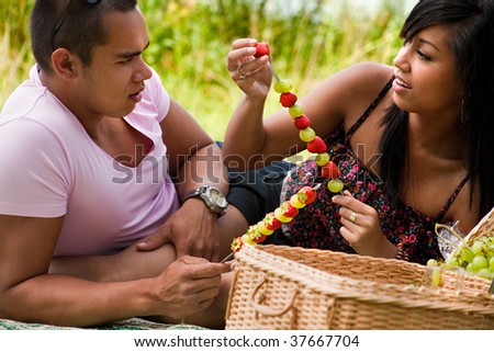 Young happy asian couple enjoying their time outdoors