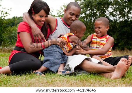 Happy black family enjoying their free day