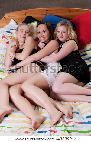 3 friends having a pajama party in a bedroom
