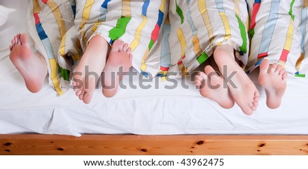 3 friends having a pajama party in a bedroom