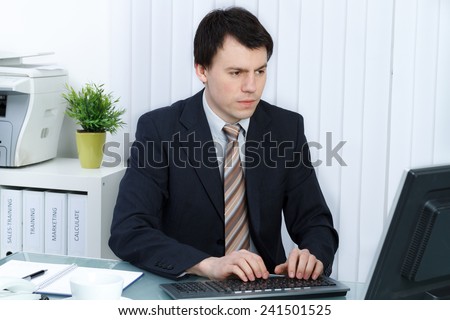 business man in office works at computer