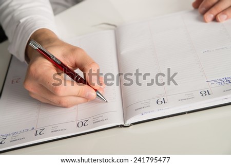 doctor writing at note book