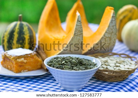 Pumpkin seeds, pumpkin cake and slices of pumpkin