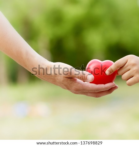 All the love given to child - love (heart) in hand
