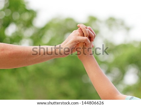 The closeness of mother and son - touch (contact)