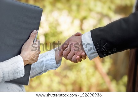 The project was contracted (successful work- handshake)