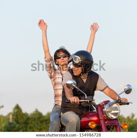 Couple enjoys riding motorcycle