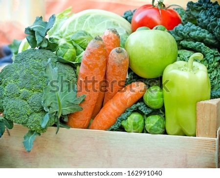 Crate full of fresh fruit and vegetable - organic food