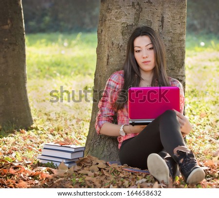 Student studying in park - Srtudent use a laptop