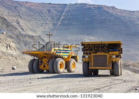 Giant Ore Trucks  in open pit mine