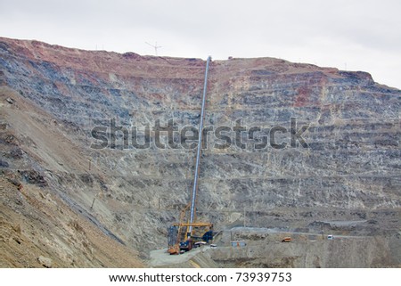 Open pit mine with ore conveyor