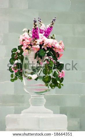 Flowers in an ice vase against an ice wall
