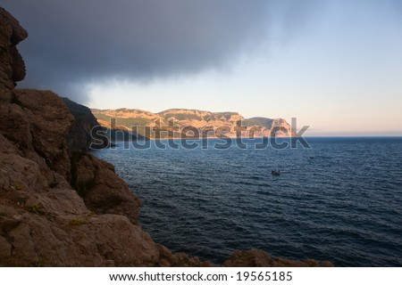 Sea landscape with rocky coast in the evening