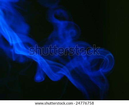 Smoke from a cigarette close up on a black background