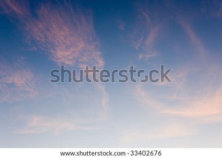Pink clouds in the night sky after sunset