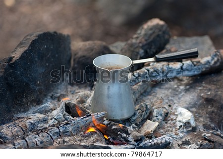 Coffee cooking on fire coals close up