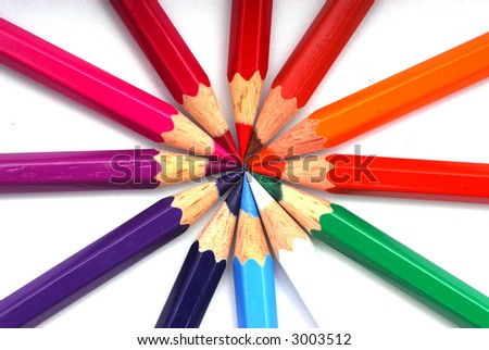 Many pencils of all rainbow colors place in the shape of the sun