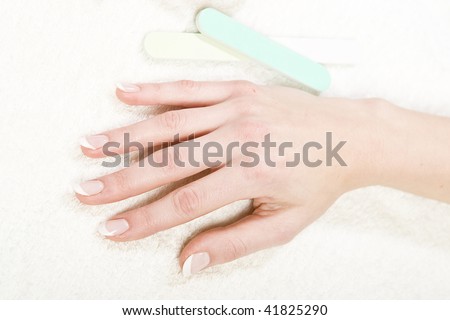 Beautiful hands with healthy skin, nails and manicure and nail file