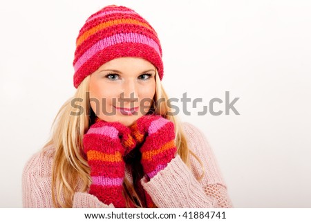 Young winter woman in red gloves